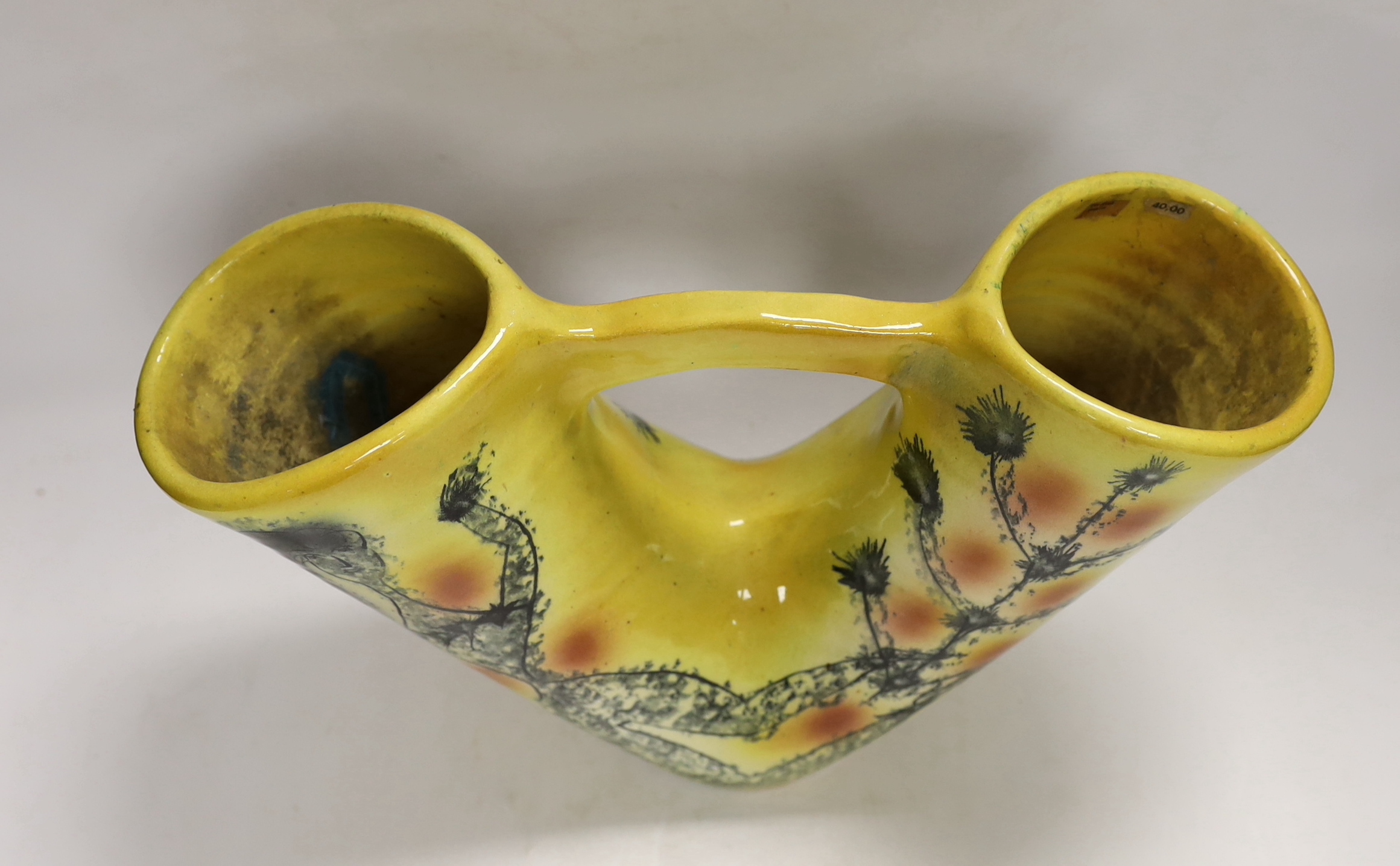 A Spanish pottery twin-stem vase on yellow ground, 24cm